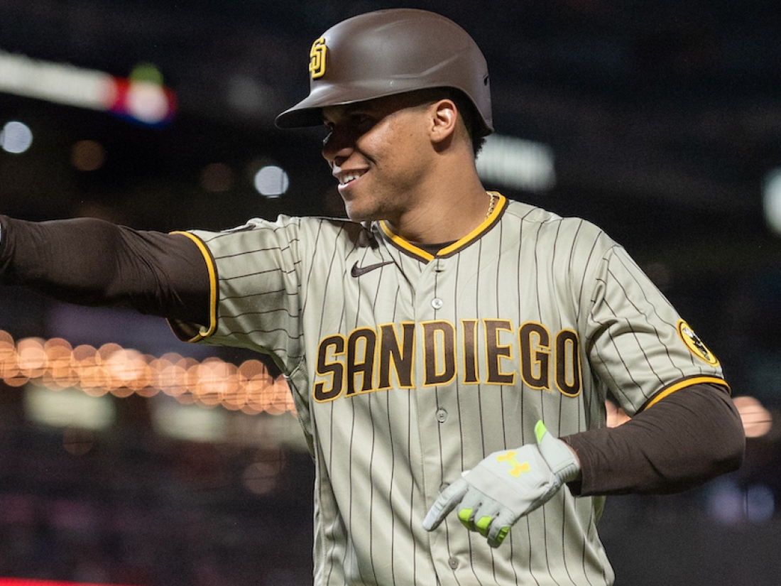 Sep 26, 2023; San Francisco, California, USA; San Diego Padres left fielder Juan Soto (22) points to hit team mates after hitting a home run during the seventh inning against the San Francisco Giants at Oracle Park. Mandatory Credit: Ed Szczepanski-USA TODAY Sports