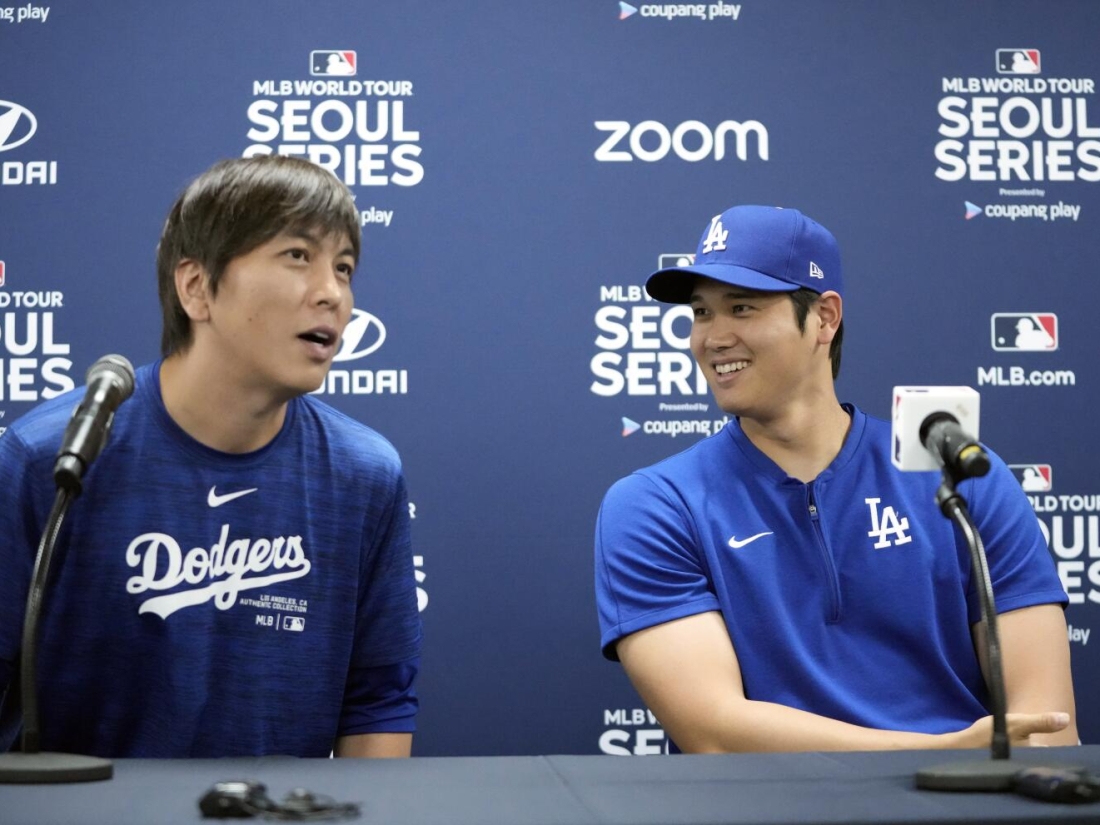 Los Angeles Dodgers' Shohei Ohtani, right, and his interpreter, Ippei Mizuhara, attend at a news conference ahead of a baseball workout at Gocheok Sky Dome in Seoul, South Korea, Saturday, March 16, 2024. Ohtani’s interpreter and close friend has been fired by the Dodgers following allegations of illegal gambling and theft from the Japanese baseball star. (AP Photo/Lee Jin-man)