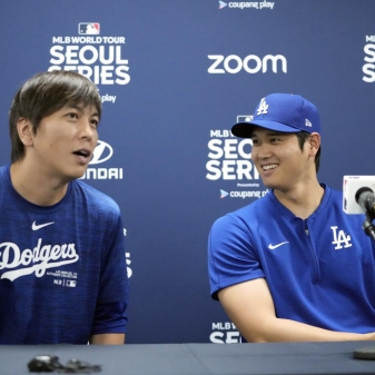Los Angeles Dodgers' Shohei Ohtani, right, and his interpreter, Ippei Mizuhara, attend at a news conference ahead of a baseball workout at Gocheok Sky Dome in Seoul, South Korea, Saturday, March 16, 2024. Ohtani’s interpreter and close friend has been fired by the Dodgers following allegations of illegal gambling and theft from the Japanese baseball star. (AP Photo/Lee Jin-man)